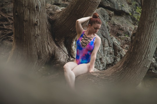 woman sitting on tree in Guelph Canada