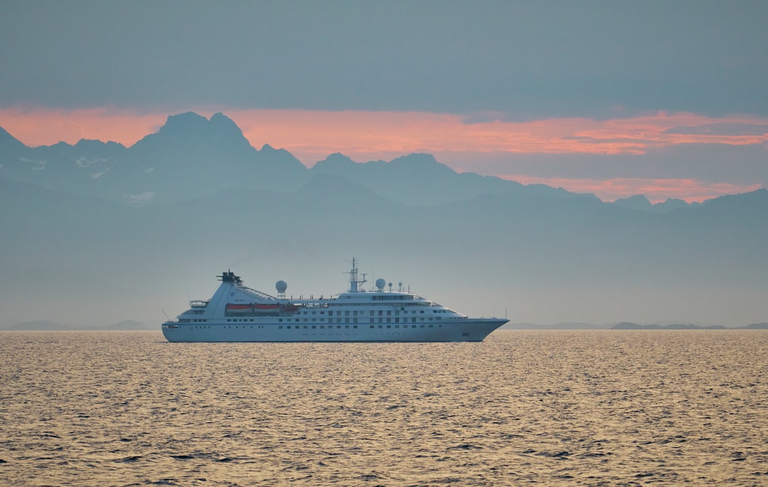 white cruise ship on body of water