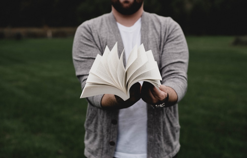 person opening book