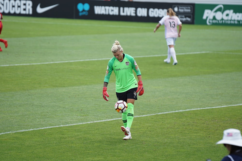 soccer player with ball at daytime