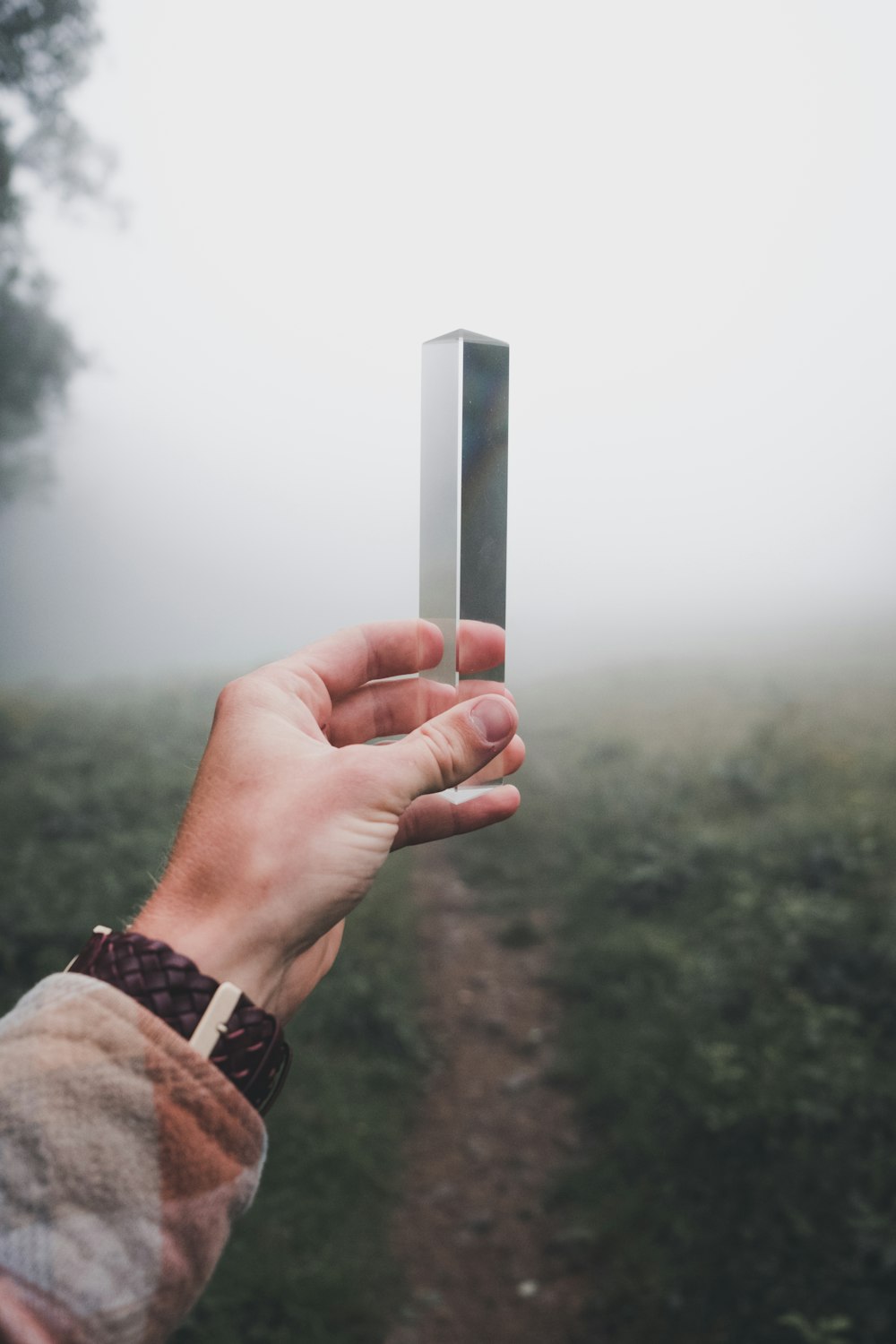 person holding gray steel box