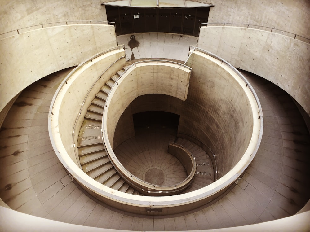 high-angle photography of spiral staircase