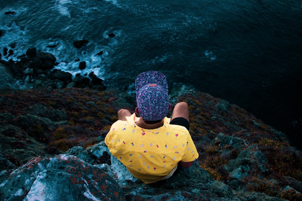 man sitting in a cliff