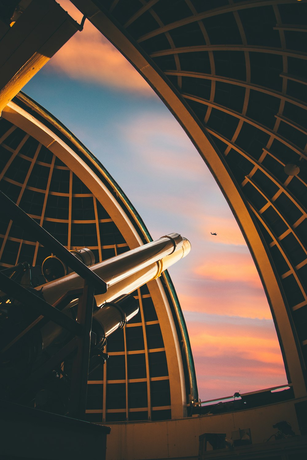 telescope pointed at helicopter on mid air