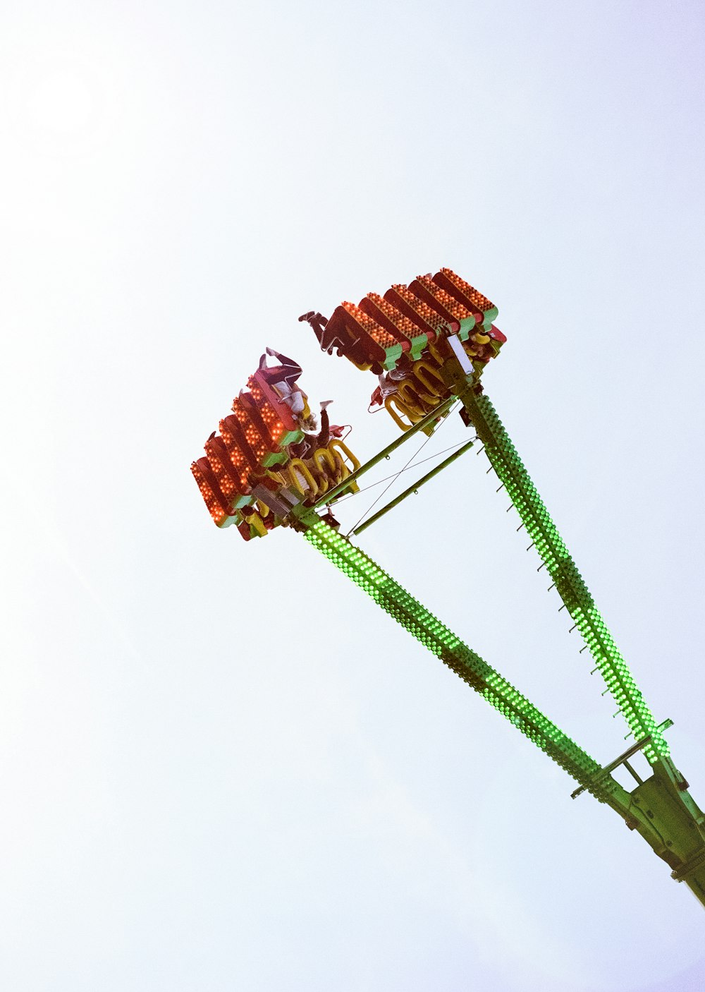 photo of people riding on swing park