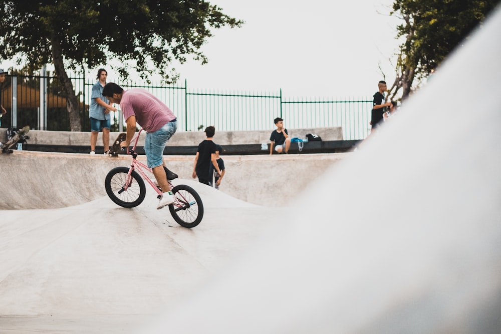 man riding BMX bike on bicycle ramp