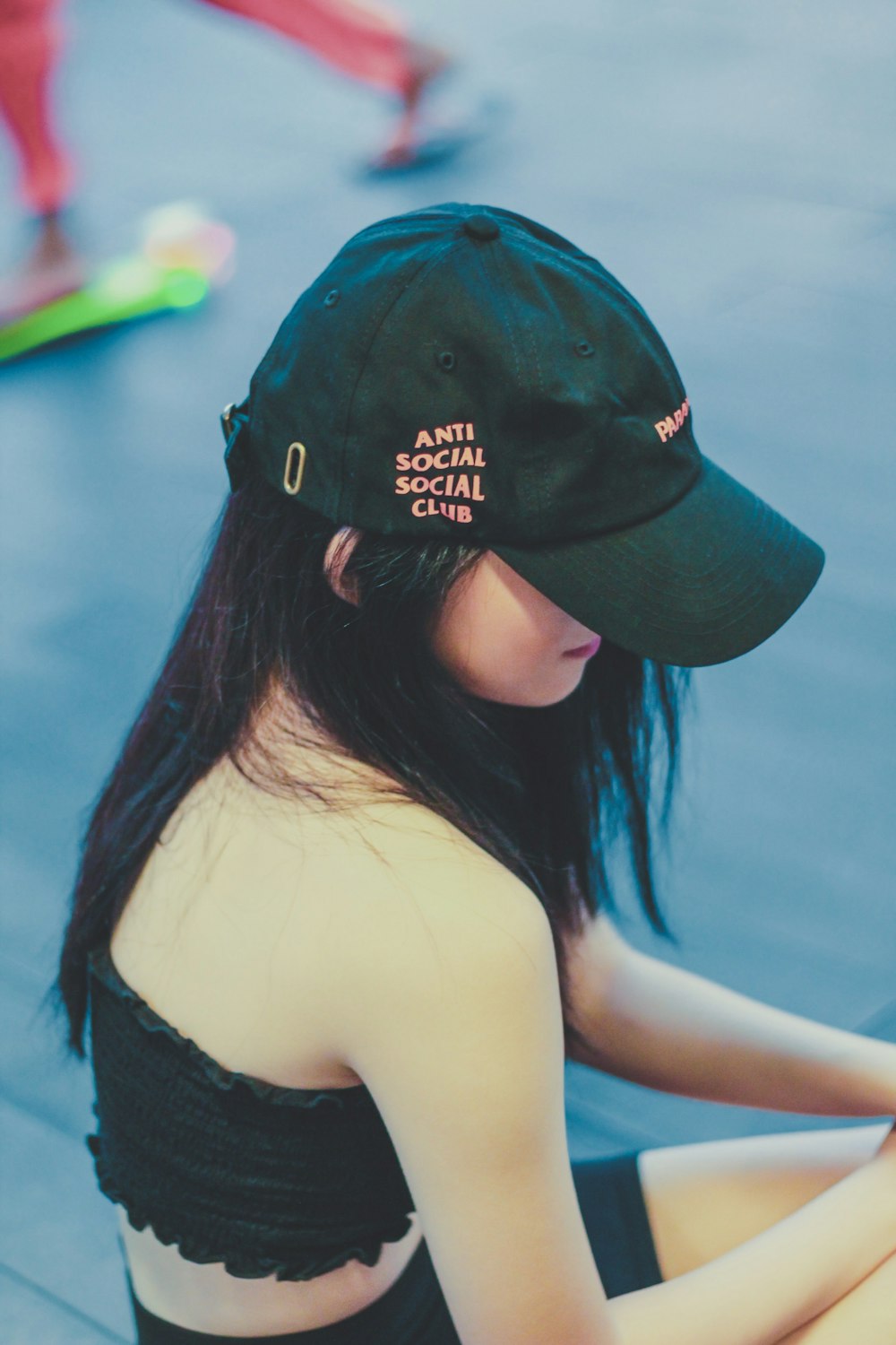 woman wearing black cap under sunny sky