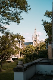A scenic view of a historic landmark surrounded by lush greenery.