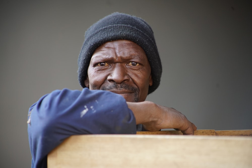 man wearing black knit cap