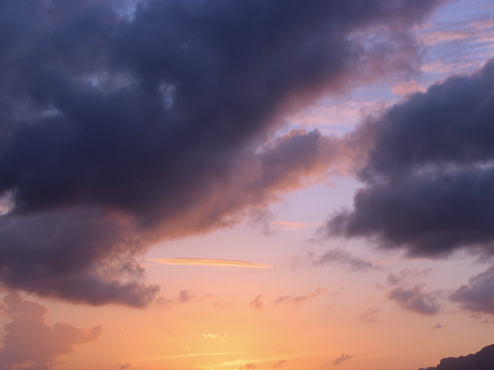 orange and gray sky with clouds