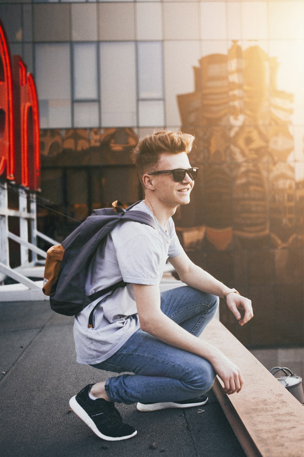 man wearing gray crew-neck shirt