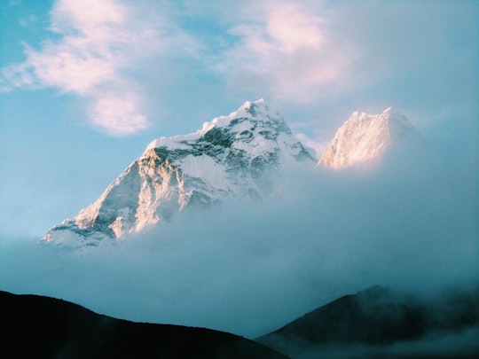 white snow-capped mountain with fog in Ama Dablam Nepal