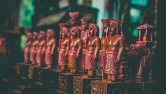 Close-up of intricately carved wooden figurines showcasing traditional Indian craftsmanship.