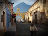The vibrant streets of Cusco framed by colonial architecture and Andean mountains.