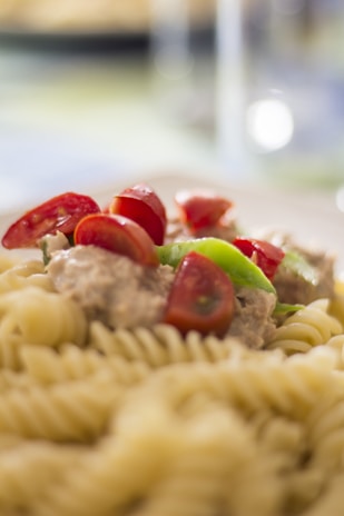 A close-up of a freshly made pasta dish with vibrant colors.