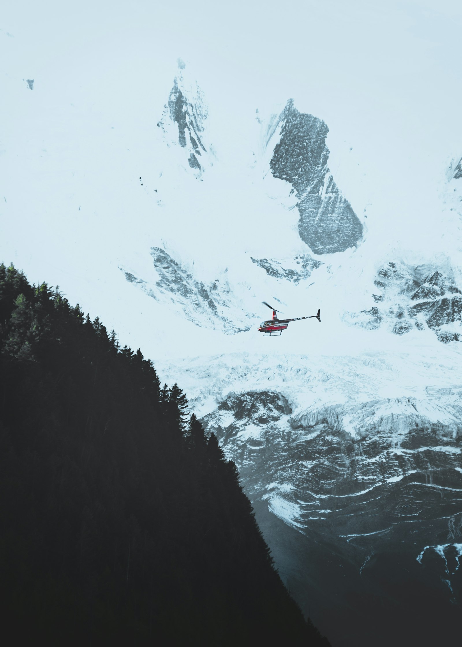 Fujifilm XF 18-135mm F3.5-5.6 R LM OIS WR sample photo. Red helicopter on snow photography