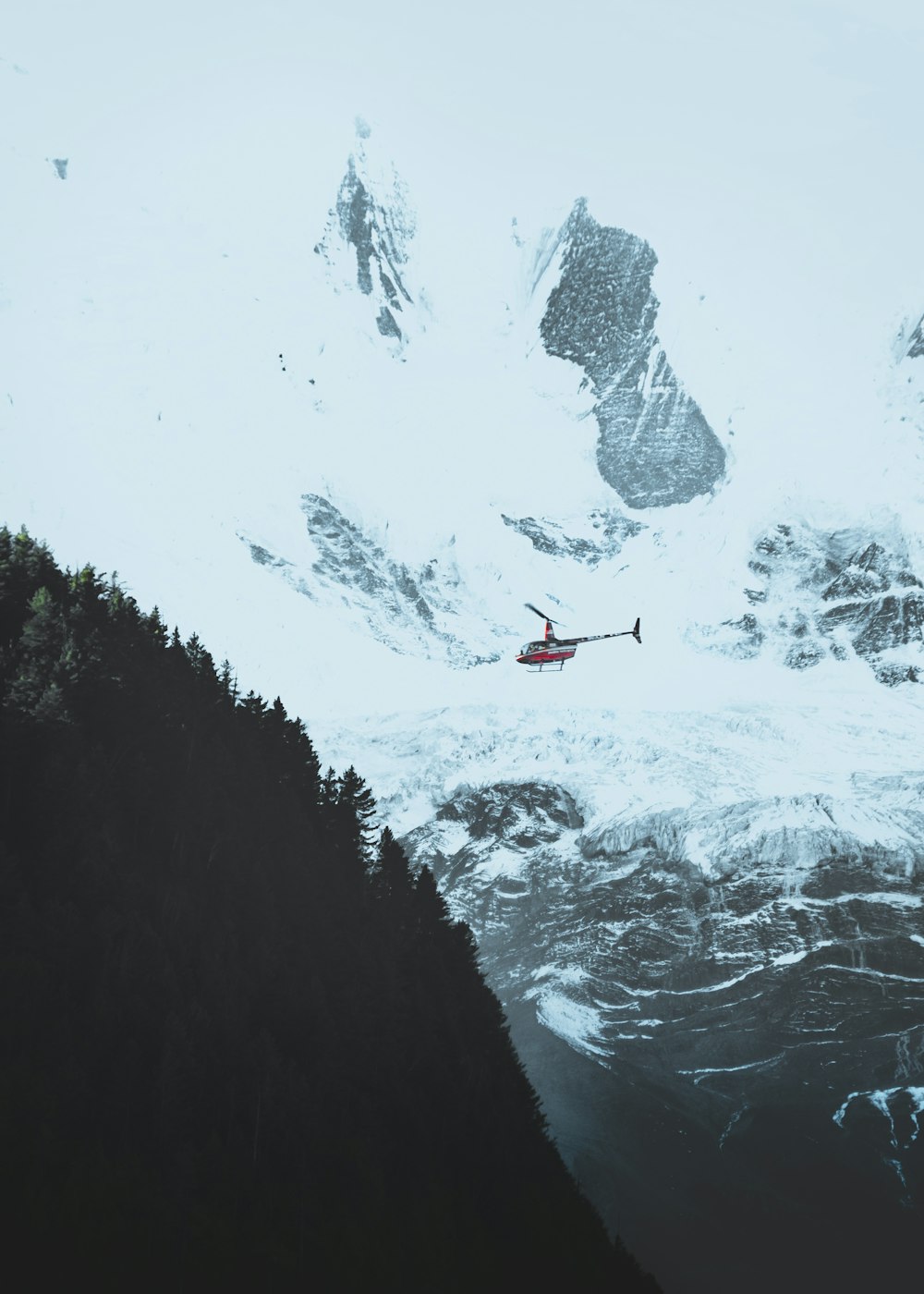 red helicopter on snow path