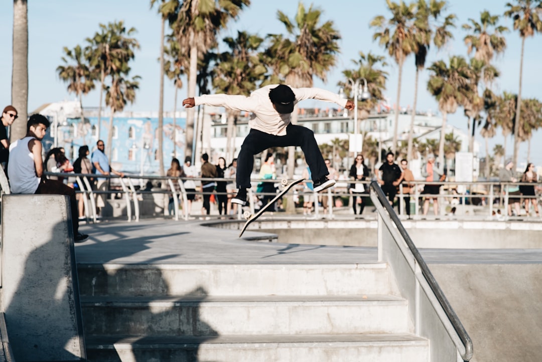 man doing skateboard trick, Venice street