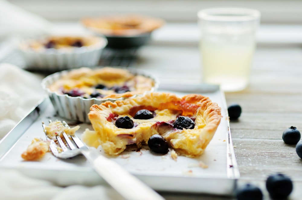 pie with berries beside fork