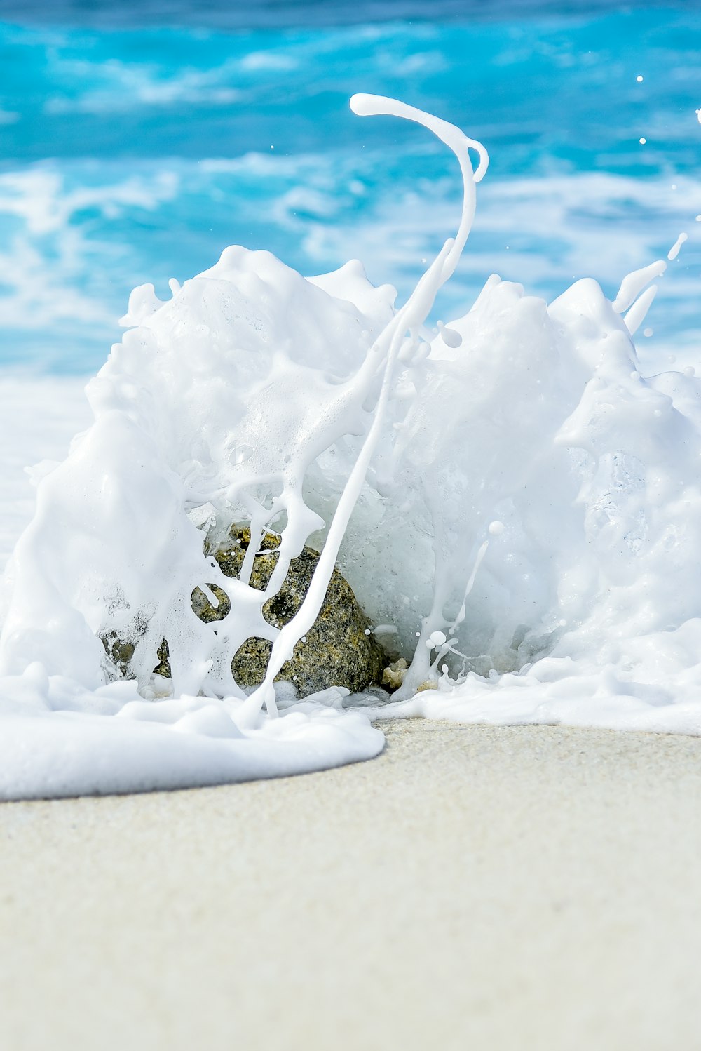 body of water splashing in stone