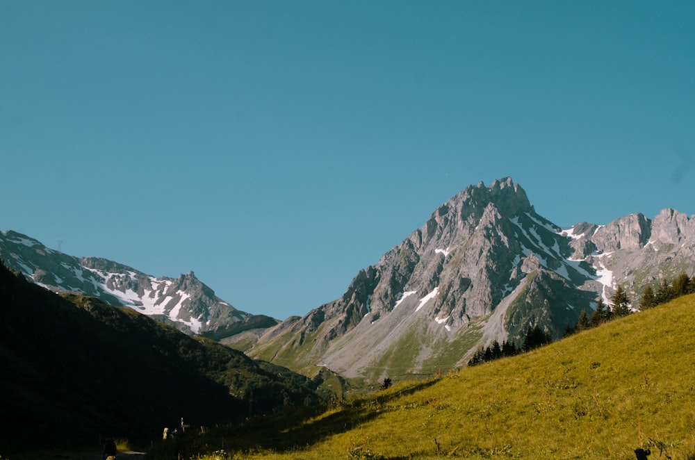 mountain range under clear blue sky