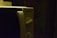 A close-up view of a microwave oven's control panel with two rotary dials and a brand name 'Techwood'. The lighting is dim, creating a shadowy ambiance.