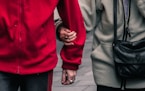 person wearing red jacket