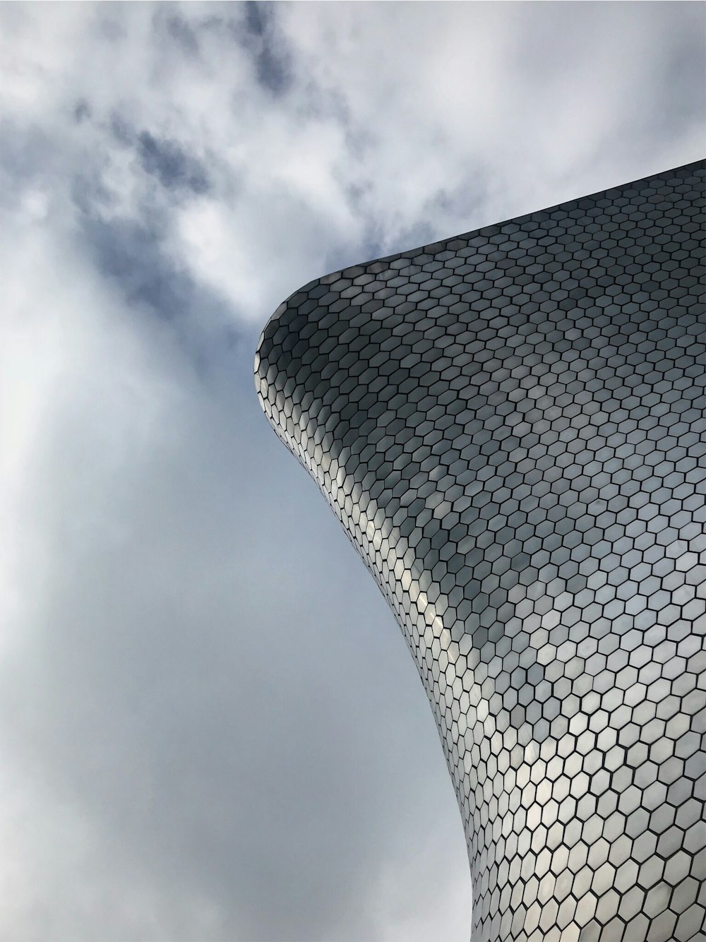 a very tall building with a sky in the background