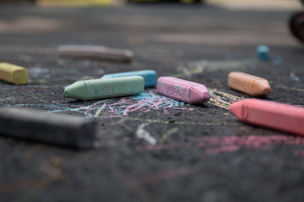 assorted color pens on floor