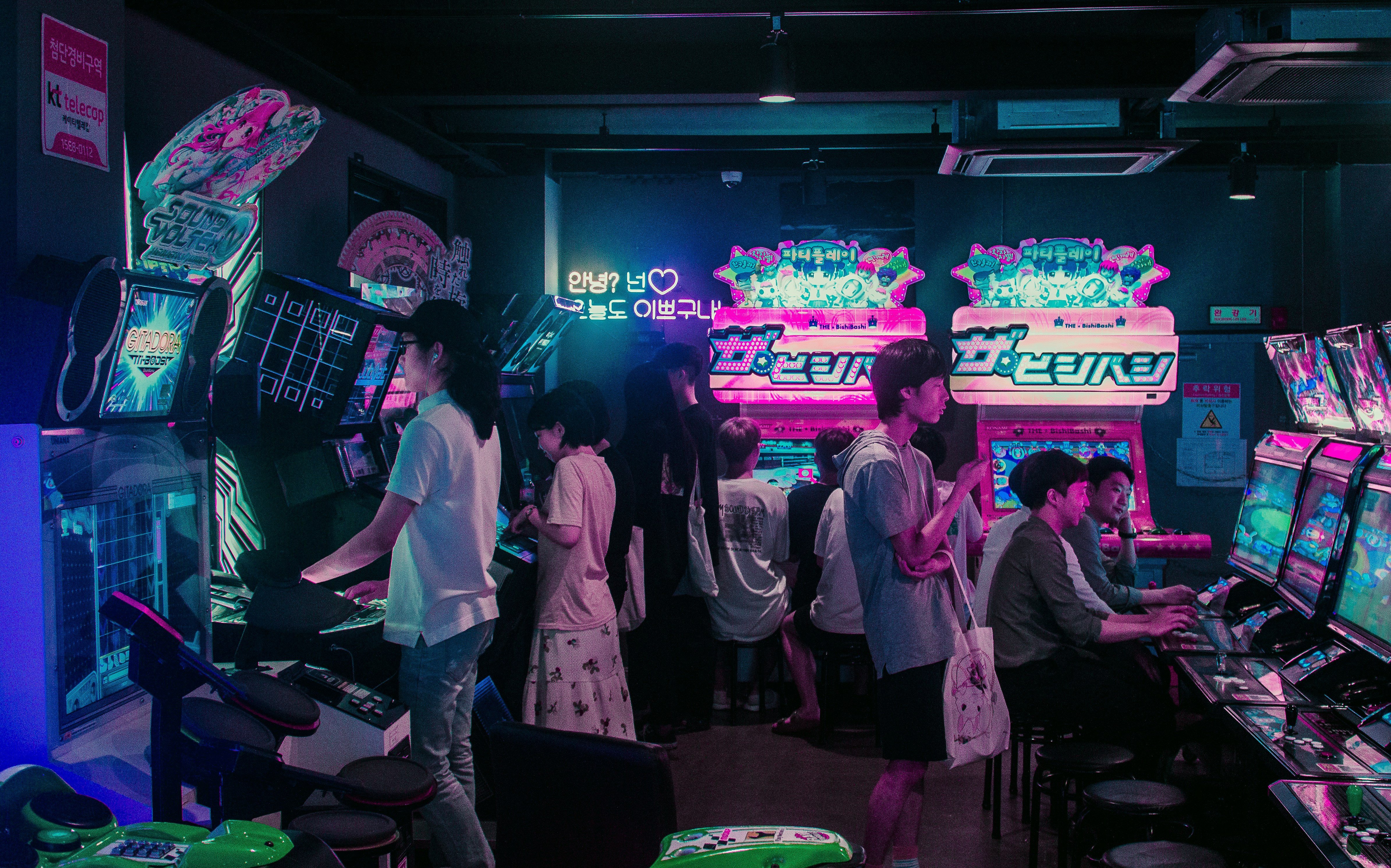 Are they playing for their entertainment or are they longing to be among the pixels of the games?