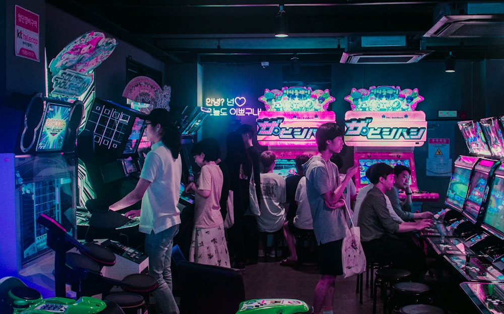 people playing arcade games