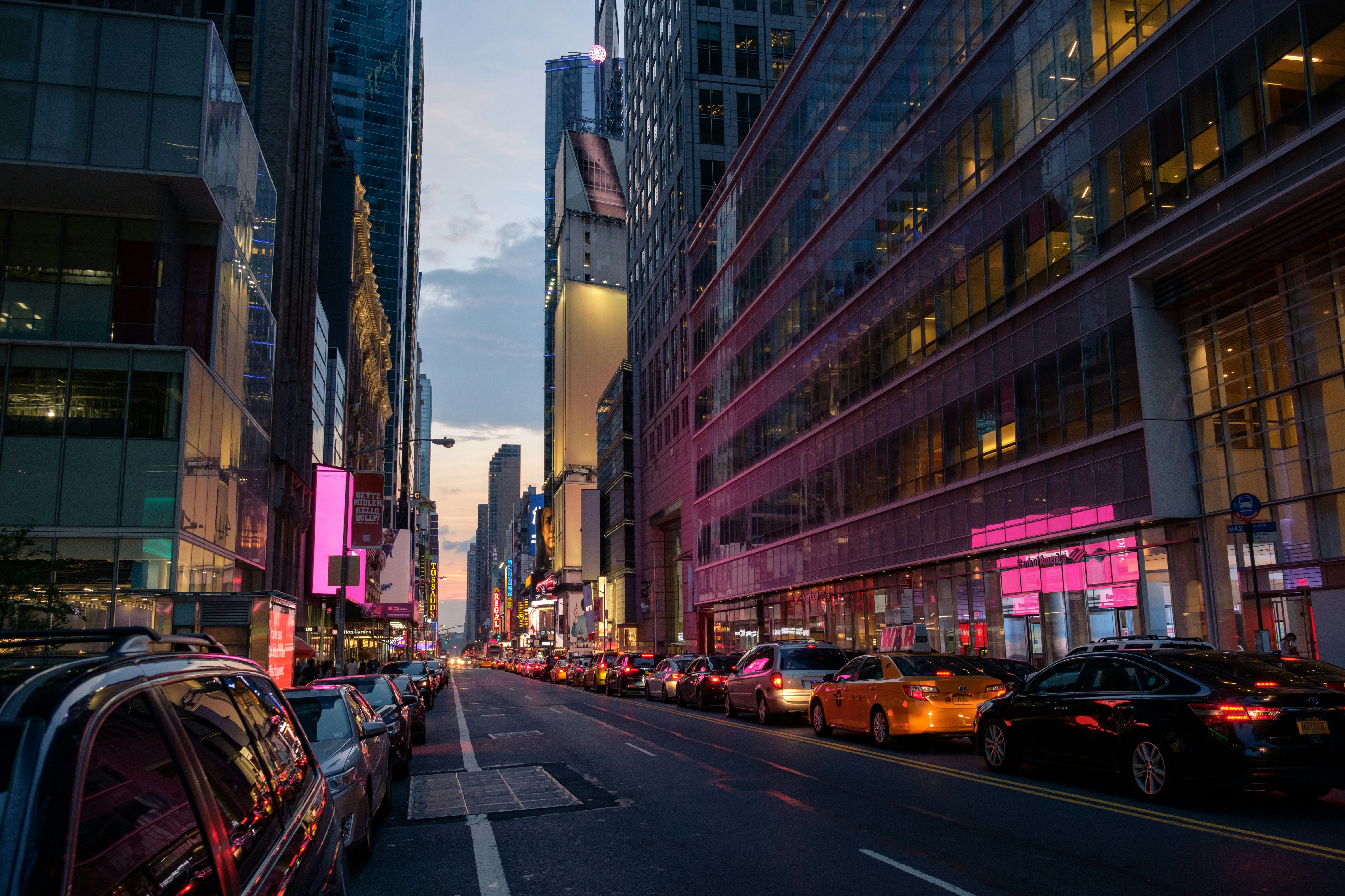 vehicles park in front of building, 