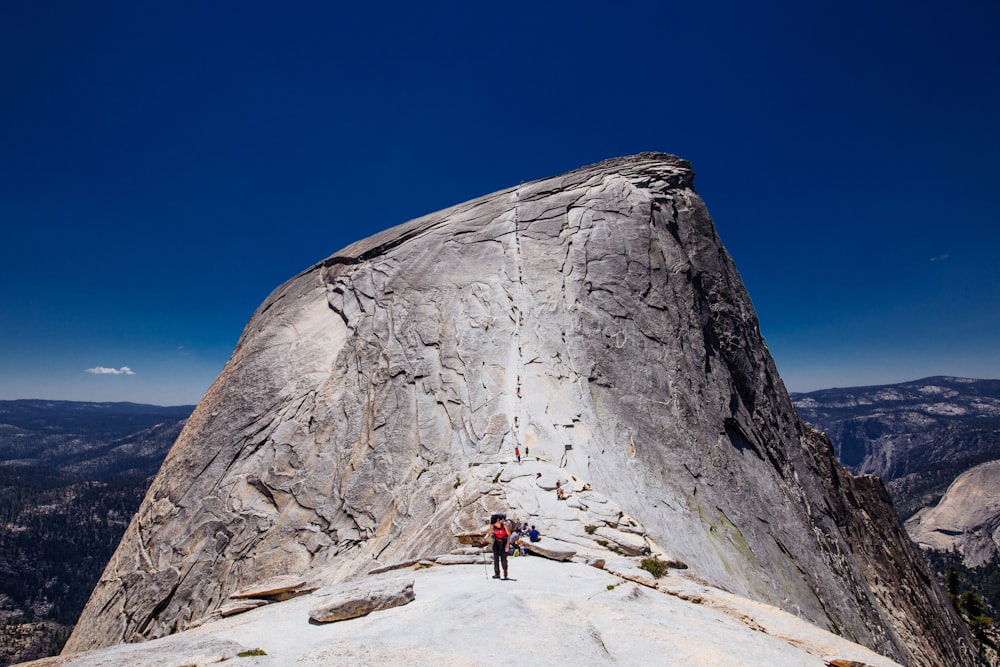 person standing on rock formation