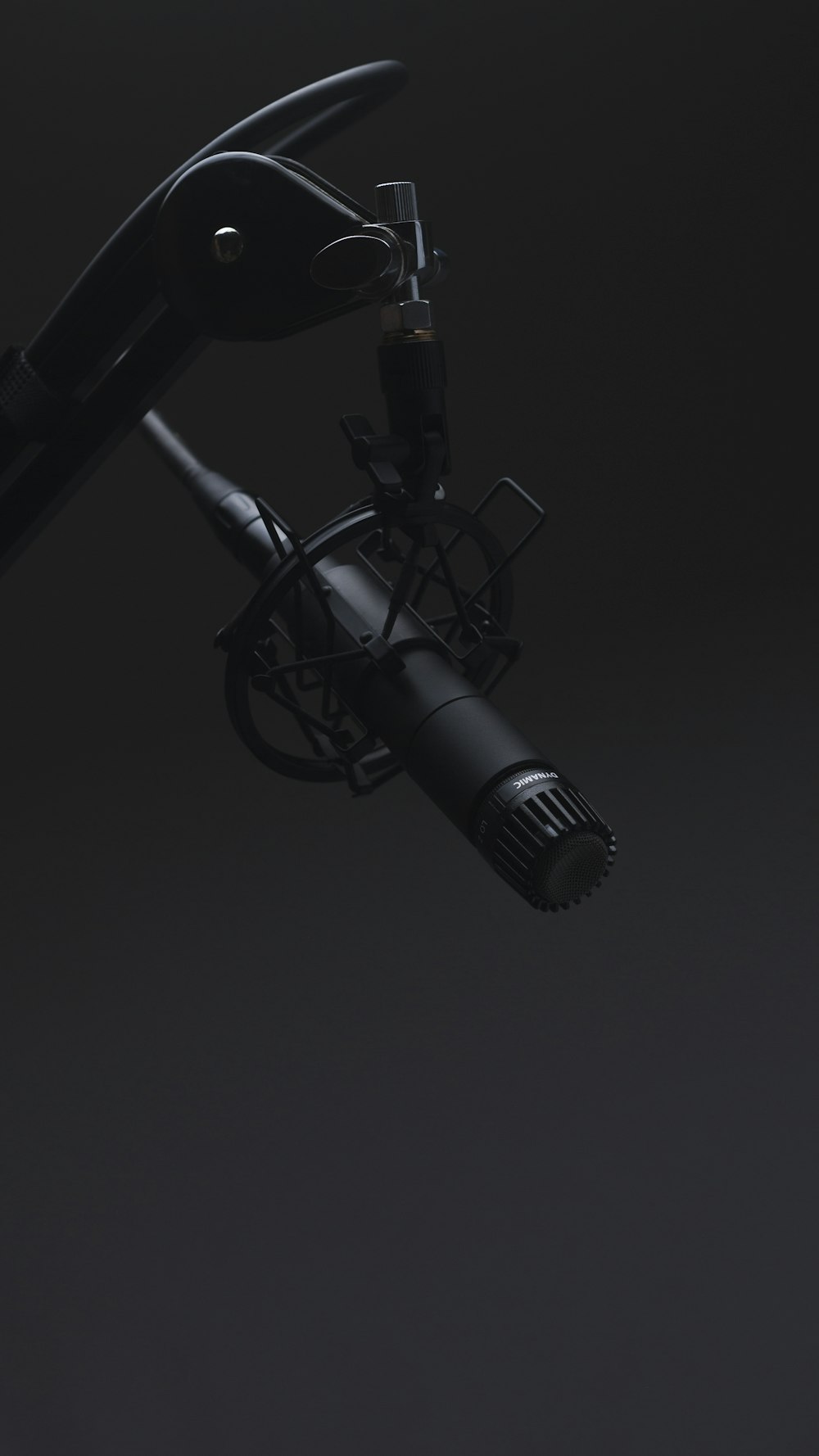 black microphone in dimmed room