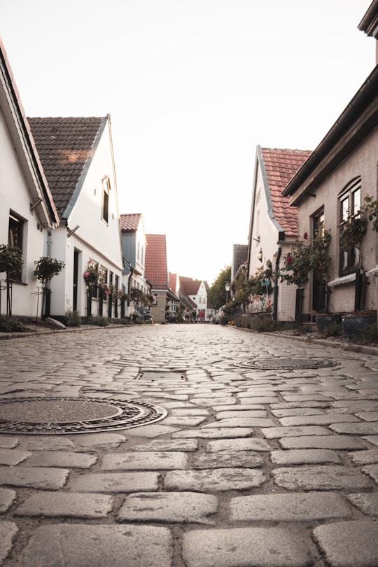 worm's eye view photography of white houses in Schleswig Germany