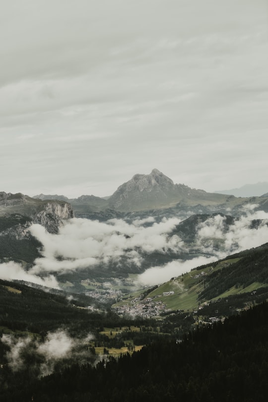 aerial photography of mountains surrounded by clouds in San Ciascian Italy