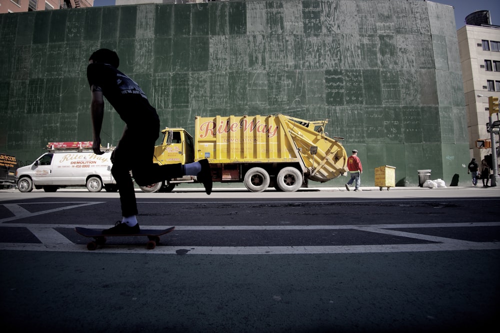 yellow dump truck in street