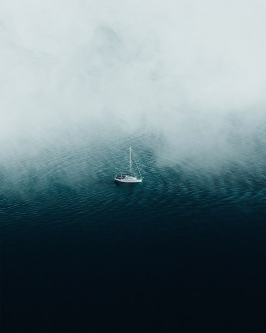 white boat floating on body of water in Mersea Island United Kingdom