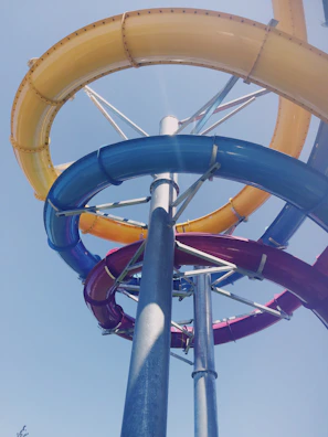 Volcano slide with bright red and orange hues spiraling down in an exciting family entertainment center.