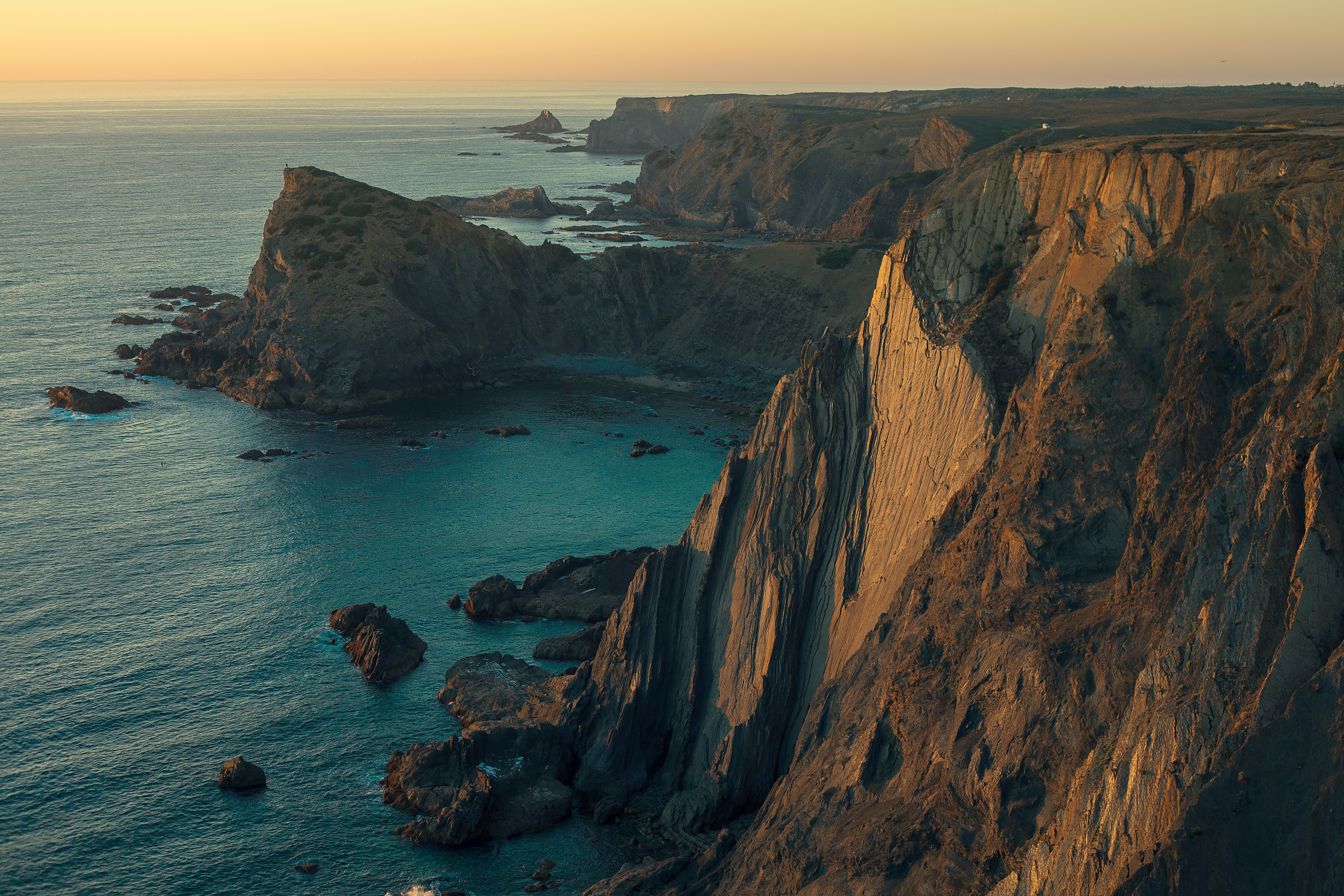 aerial photography of mountain near sea