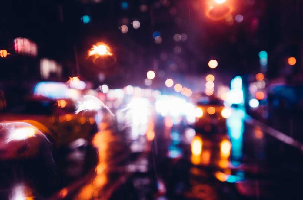 a blurry photo of a city street at night