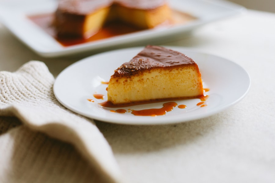 A dense slice of golden baked custard with caramelized top on a white plate