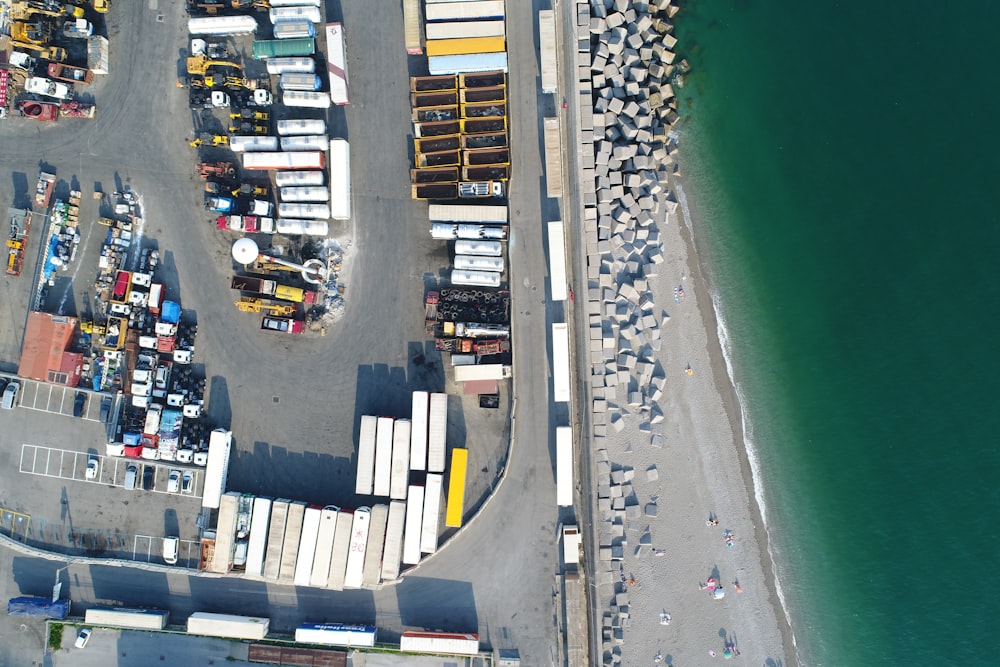 intermodal container lot near body of water during daytime