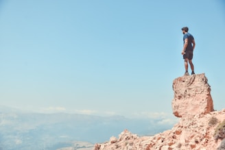man standing on rock