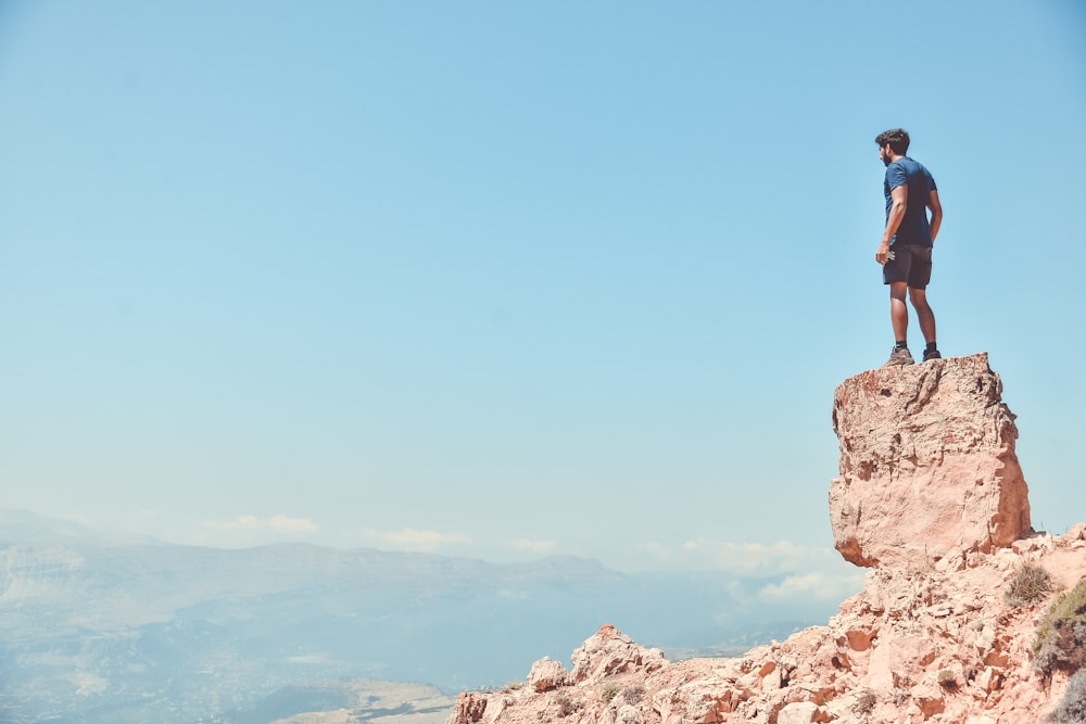 man standing on rock