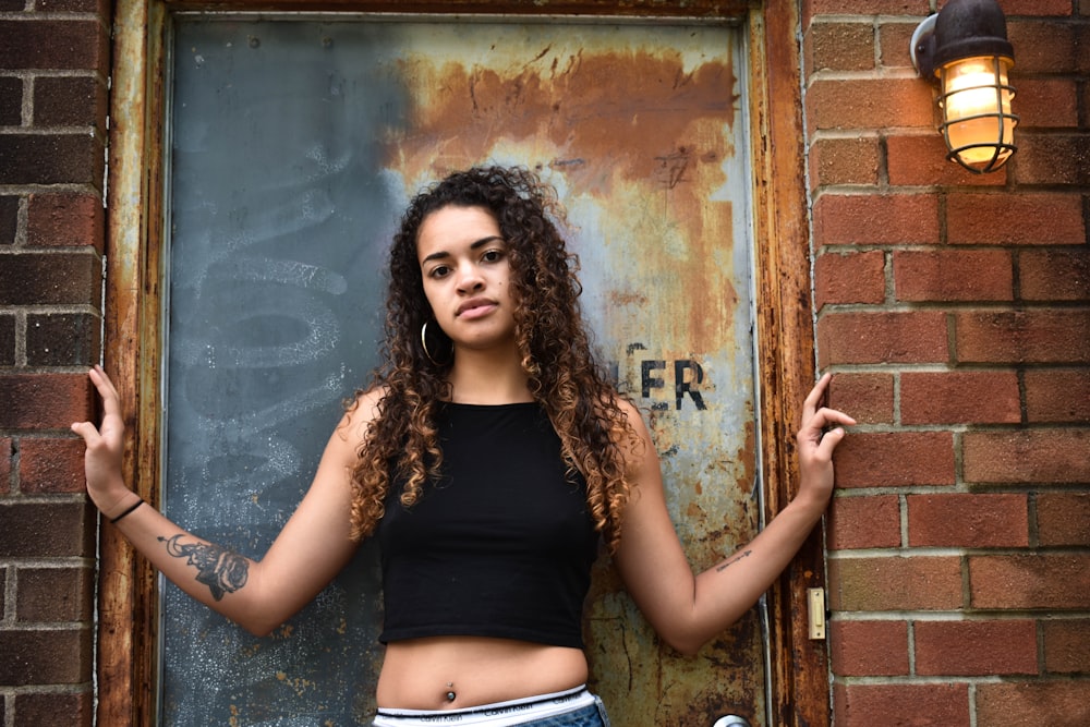 woman standing in front of steel door