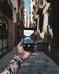 A traveler activating an eSIM on a smartphone with Montenegro map in background.