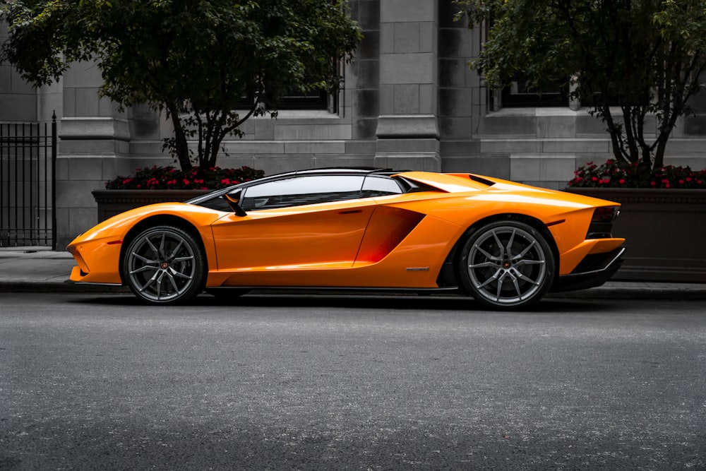 orange sports car on roadway photo – Free Car Image on ...