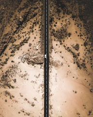 bird's eye view photography of white car on road