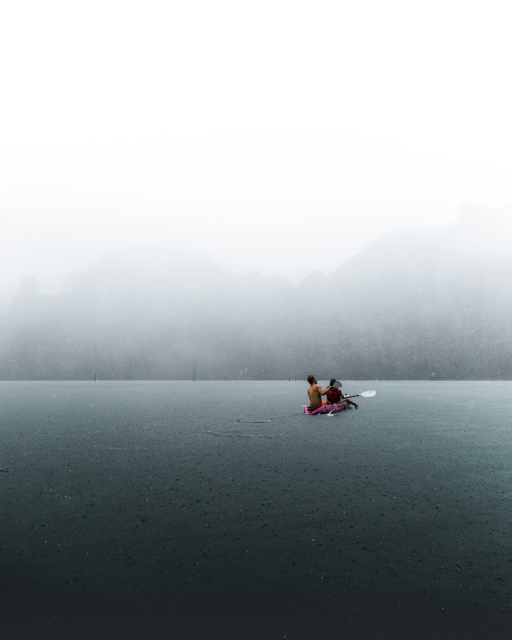 person in boat on body of water